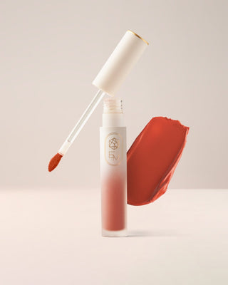 EM Cosmetics Soft Spoken Velvet Lip Creme in Manifest, a rich berry shade for a bold, statement lip with a velvet feel.