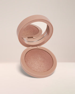 Open compact of EM Cosmetics Heaven's Glow Radiant Veil Blush in Rococo, showing the marbled satin powder texture.