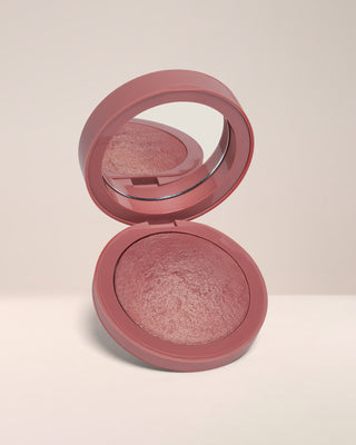 Open compact of EM Cosmetics Heaven's Glow Radiant Veil Blush in Venetian Rose, showing the marbled baked texture.